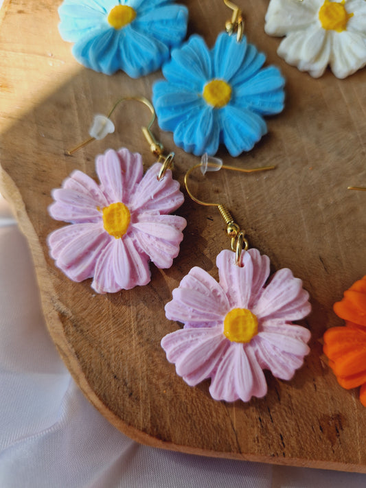 Boucles fleurs rose pale.